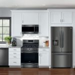 white kitchen with stainless steel appliances