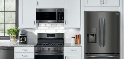 white kitchen with stainless steel appliances