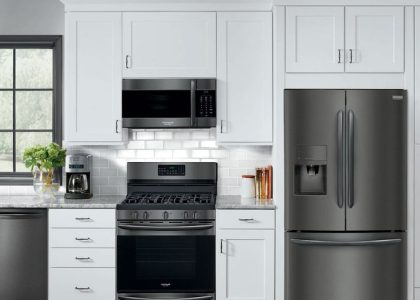 white kitchen with stainless steel appliances